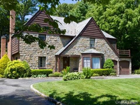 40 Chapel Road Manhasset, NY 11030 - Photo 1 of 1 a front view of a house with a yard