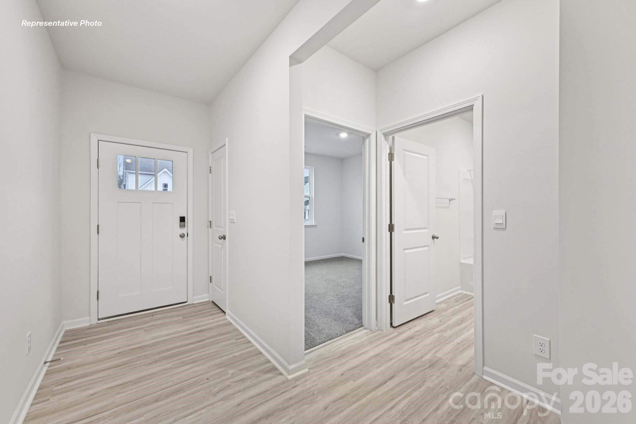 7881 Old Brk Road Sherrills Ford, NC 28673 - Photo 2 of 26 a view of a hallway with wooden floor
