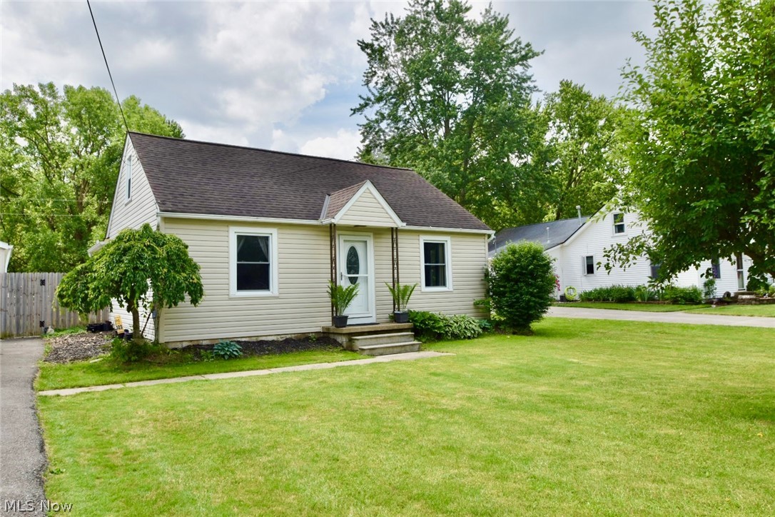 View of front of property with a front yard