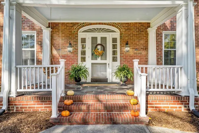 front view of a house with a large window