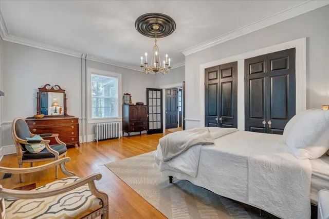 a bedroom with bed and window