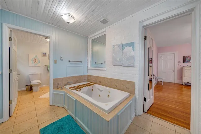 a bathroom with a toilet sink and shower