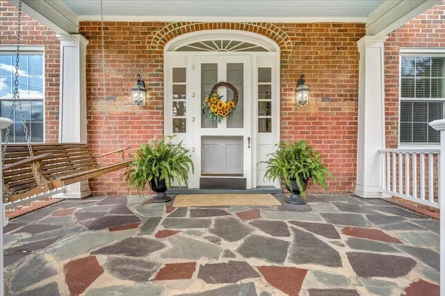 a front view of a house with garden
