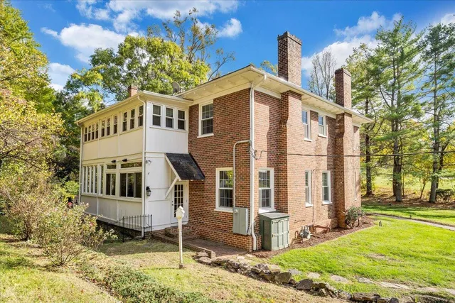 a view of a chairs and table on the wooden deck