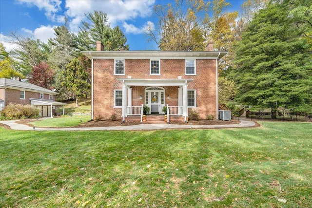 a backyard of a house with outdoor seating