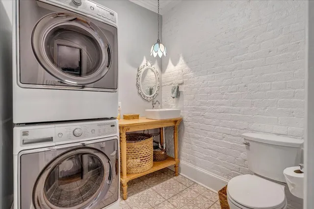 a bathroom with a sink a mirror and toilet