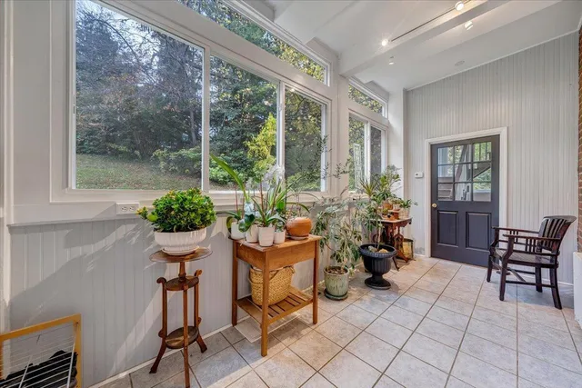 a dining room with furniture and wooden floor