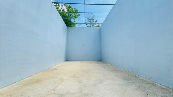 a view of a small space with a fan