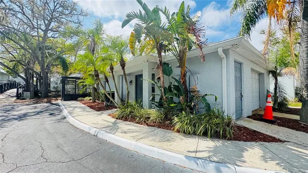 a wooden bench sitting in front of a building