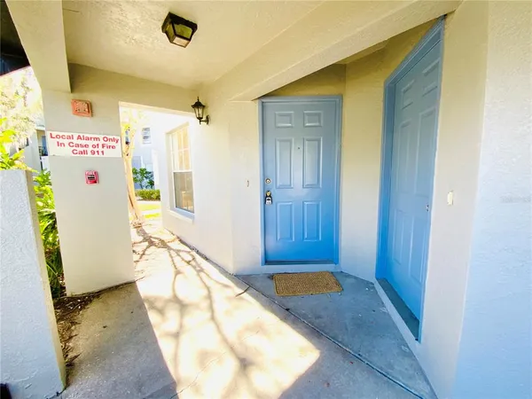 a view of a bathroom with a tub and shower