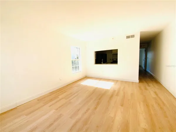 a view of a big room with wooden floor