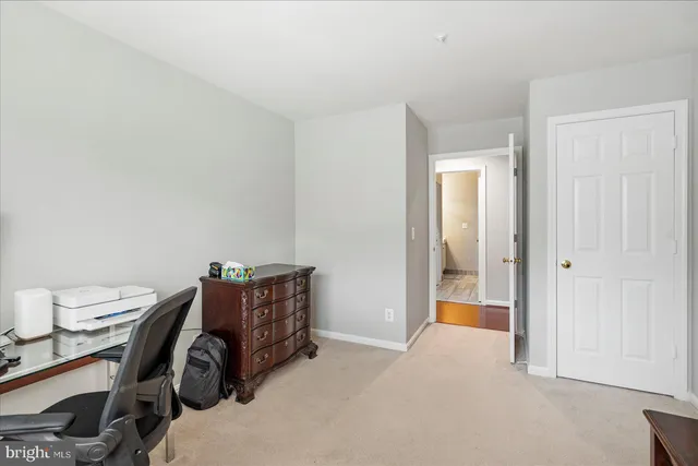 a room with a table and a lamp