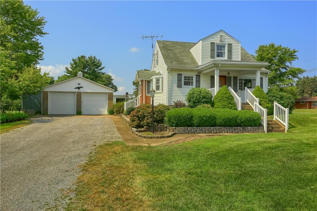 420 Big Knob Road Rochester, PA 15074 - Photo 1 of 24 a front view of a house with a garden