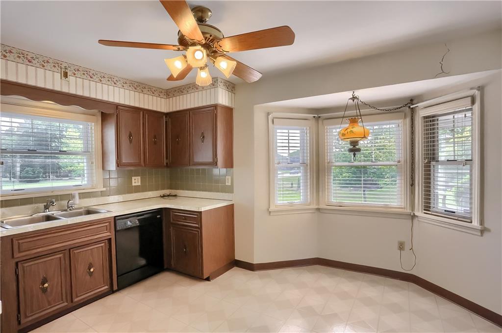 420 Big Knob Road Rochester, PA 15074 - Photo 7 of 24 a kitchen with a sink stove and cabinets