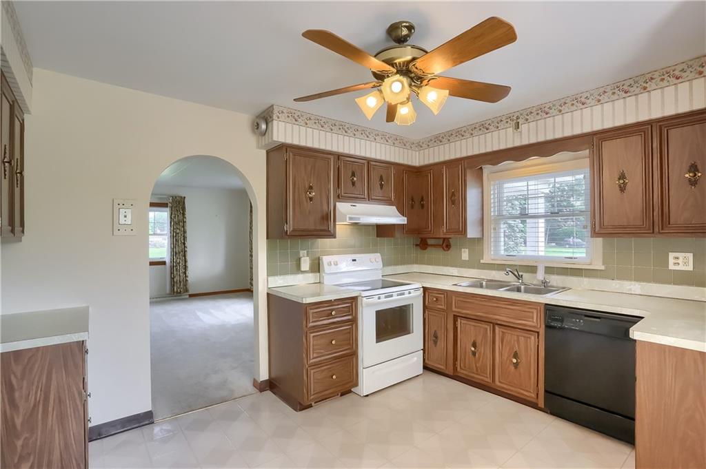420 Big Knob Road Rochester, PA 15074 - Photo 8 of 24 a kitchen with a sink stove and cabinets