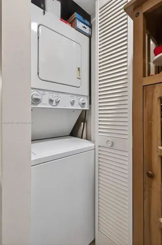 a bedroom with a bed a couch and a window