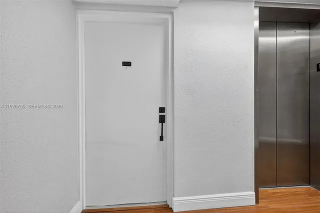 a view of a bathroom with a tub and mirror