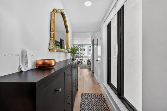 a view of hallway with wooden floor