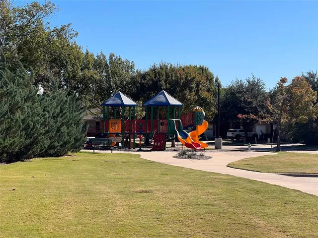 a view of a swimming pool with an outdoor space and seating area