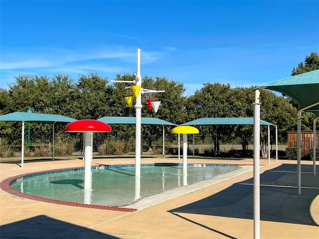 a view of a swimming pool with a patio
