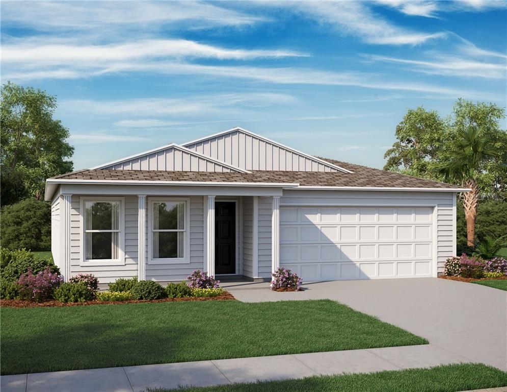 2237 Rio Grande Canyon Loop Poinciana, FL 34759 - Photo 1 of 1 a front view of a house with a yard