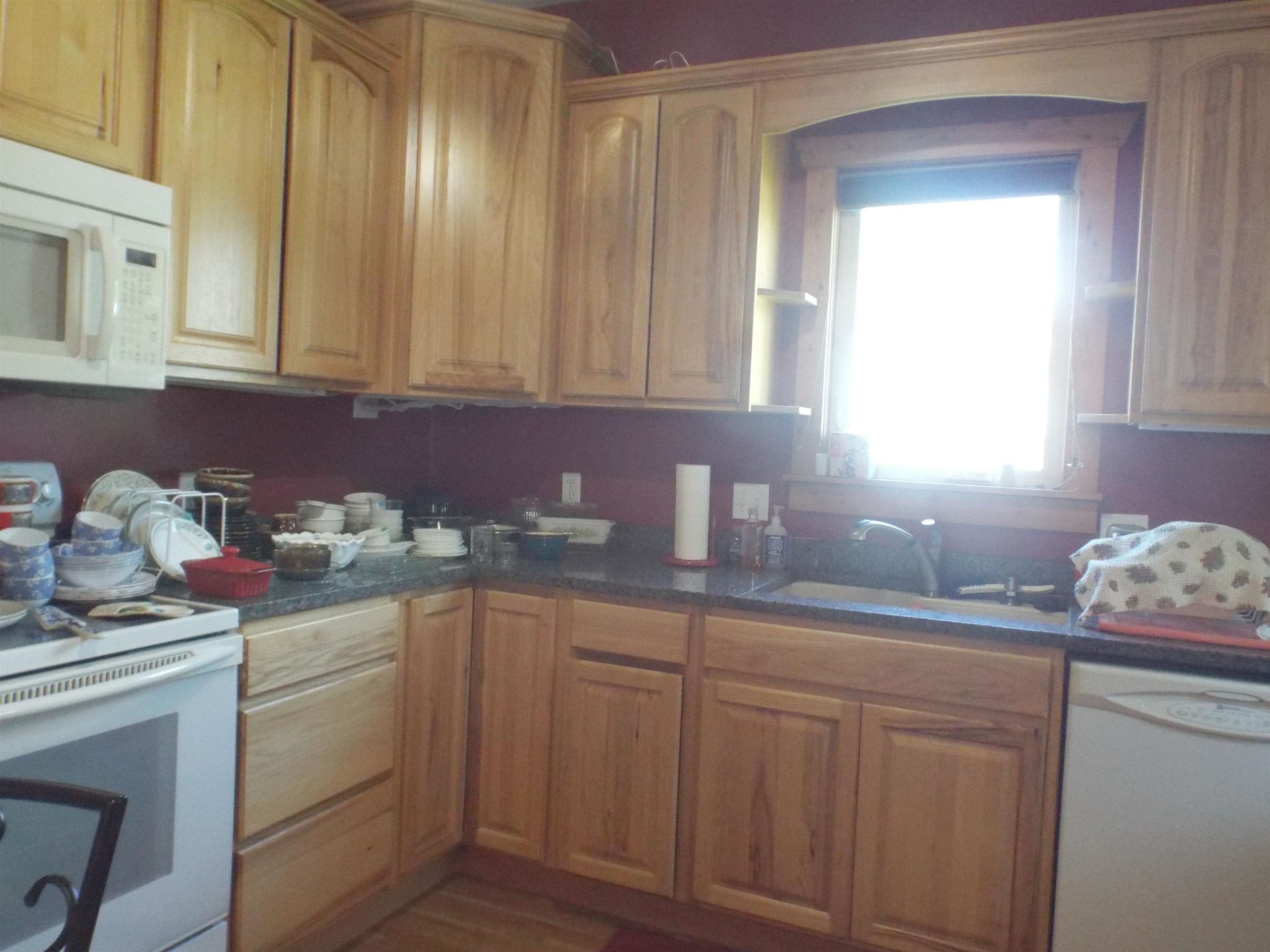 416 Chestnut Street Warren, IL 61087 - Photo 2 of 23 a kitchen with white cabinets and sink
