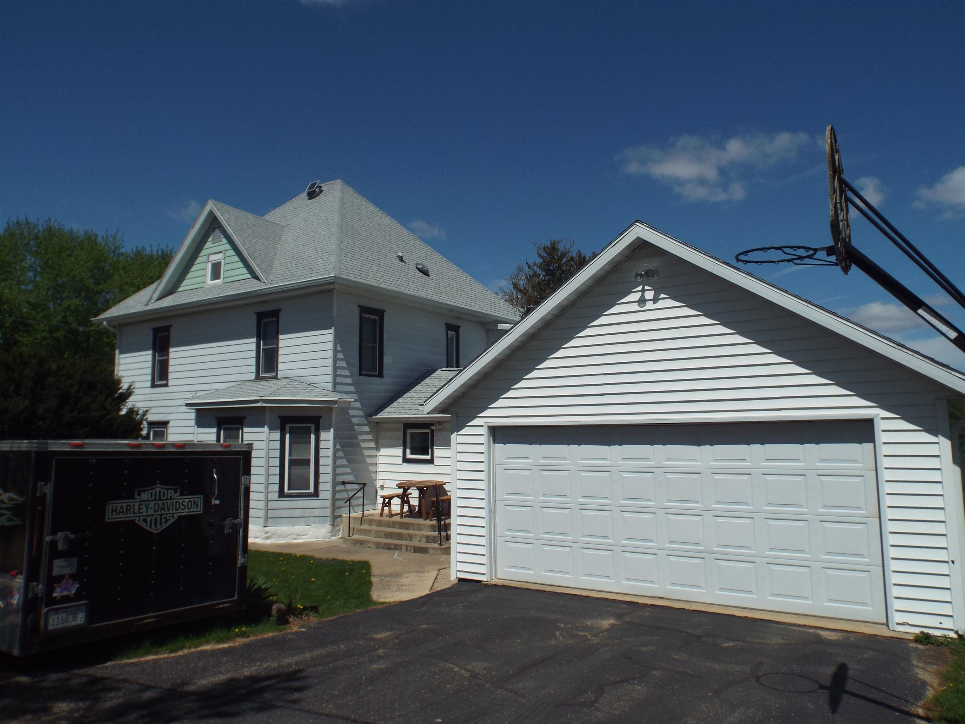 416 Chestnut Street Warren, IL 61087 - Photo 21 of 23 a front view of a house with a garage