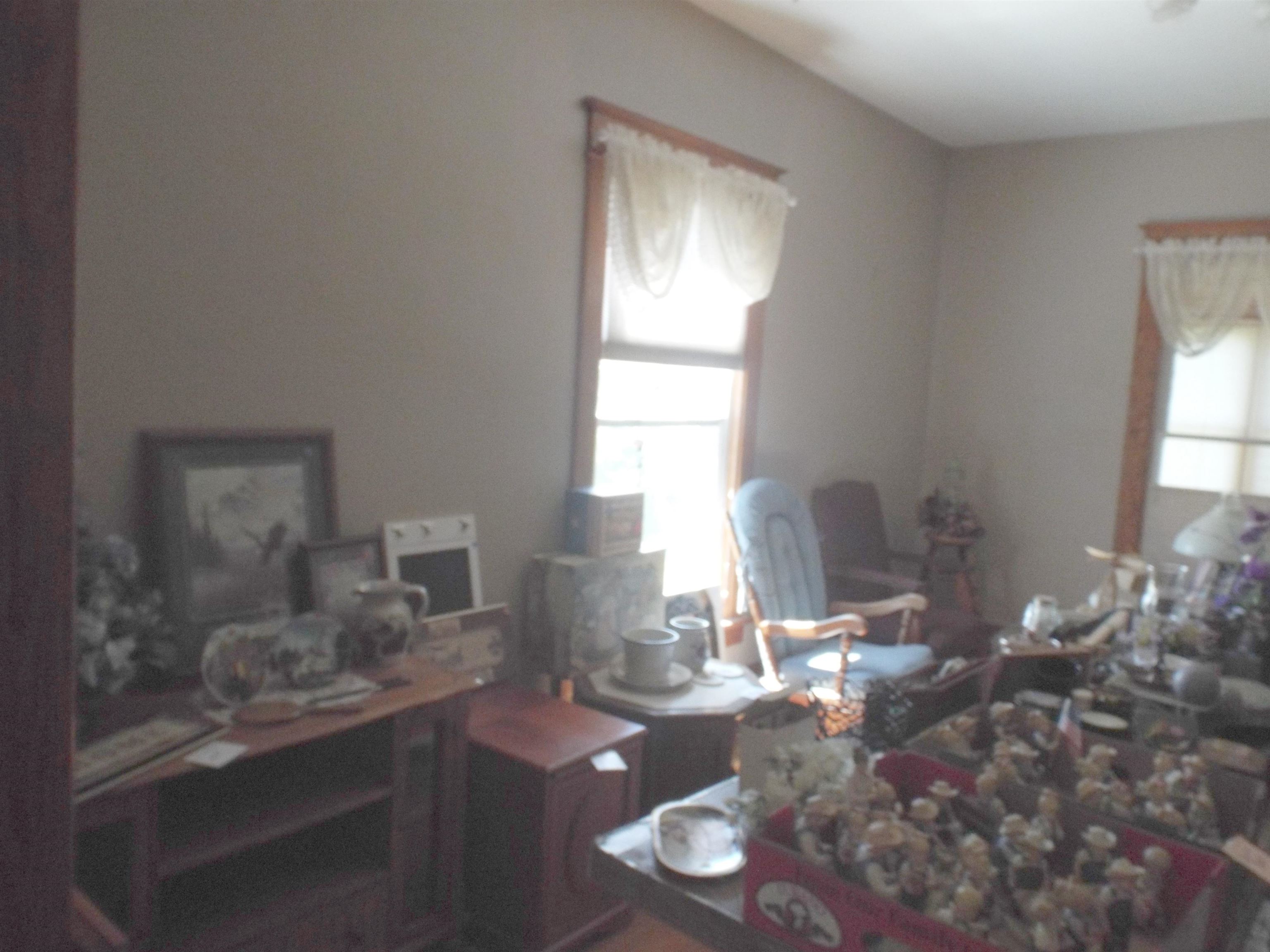 416 Chestnut Street Warren, IL 61087 - Photo 6 of 23 a dining room with furniture window and wooden floor