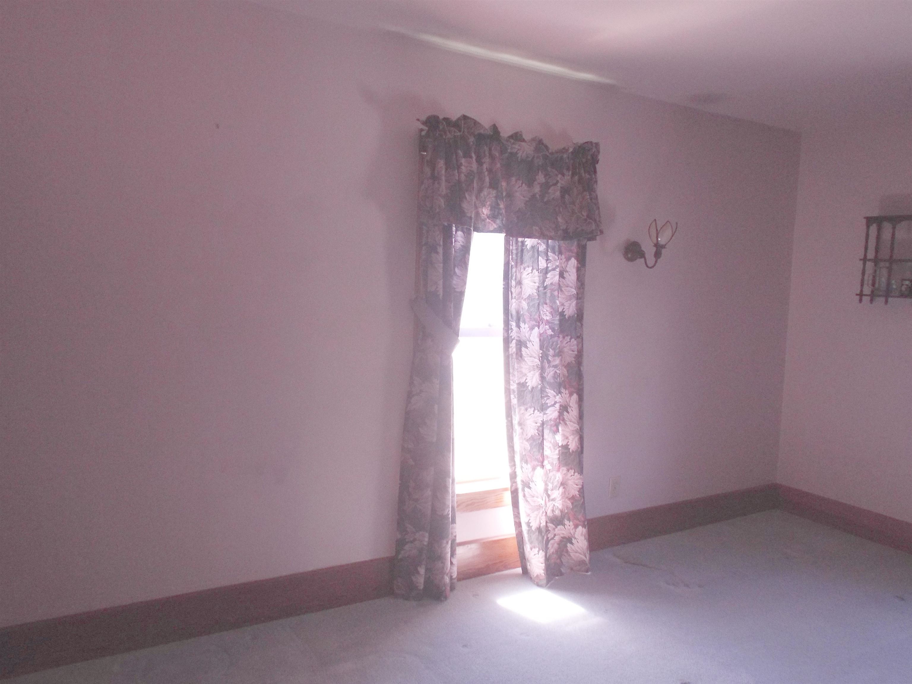 416 Chestnut Street Warren, IL 61087 - Photo 7 of 23 a view of an empty room with a window