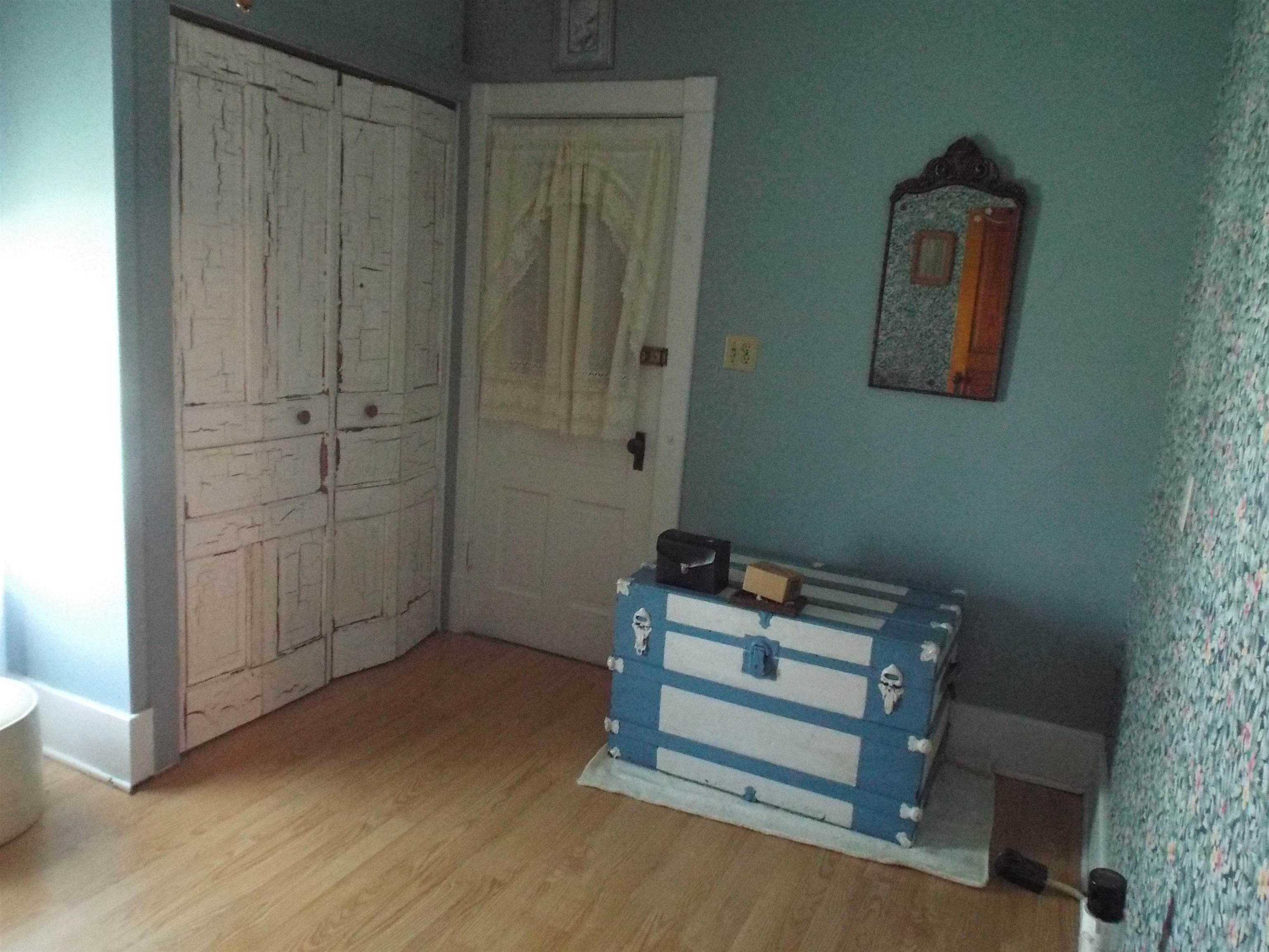 416 Chestnut Street Warren, IL 61087 - Photo 10 of 23 a view of room with hardwood wall and closet