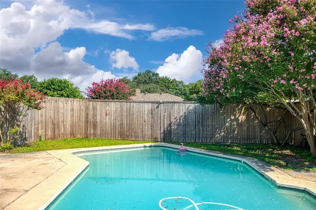 a view of a backyard with a garden