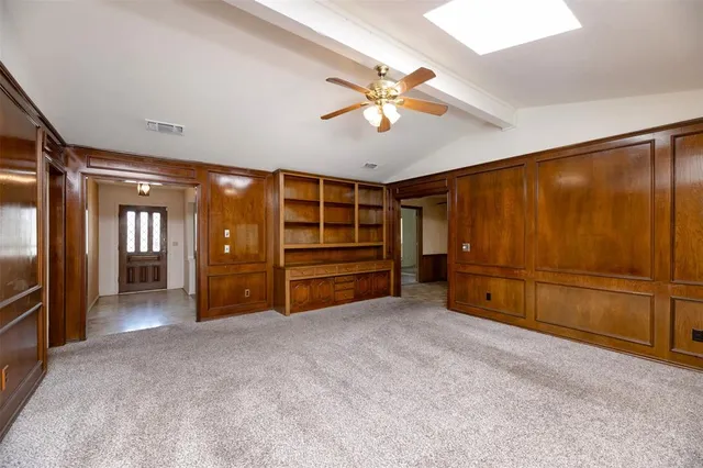 a view of an empty room with a cabinet