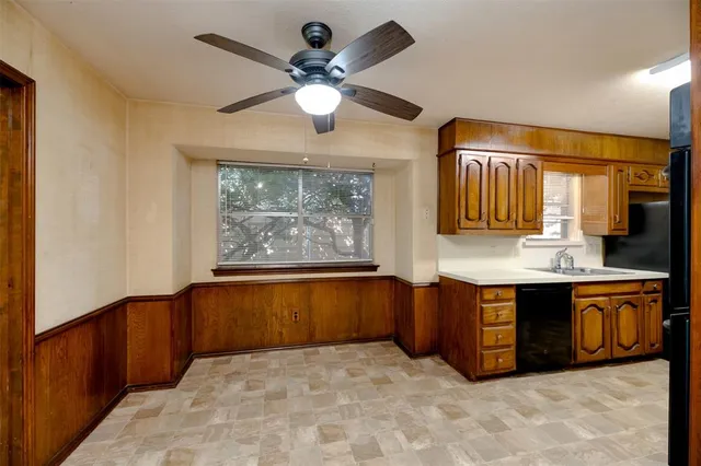 a large bathroom with a large tub and sink