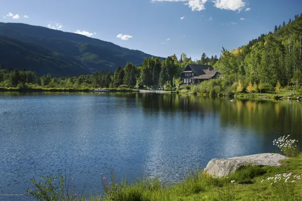 a view of a lake with a yard