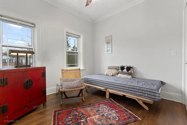 a bedroom with bed and window