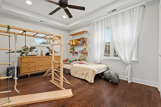 a bedroom with furniture and window