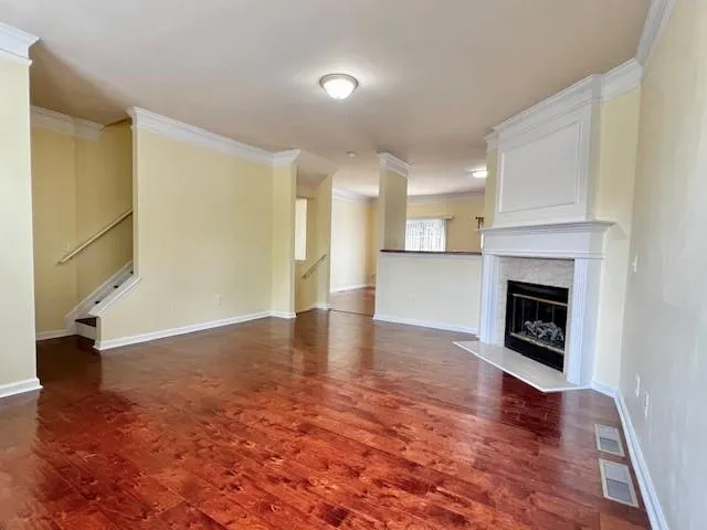 a view of a livingroom with a fireplace a fireplace and entryway