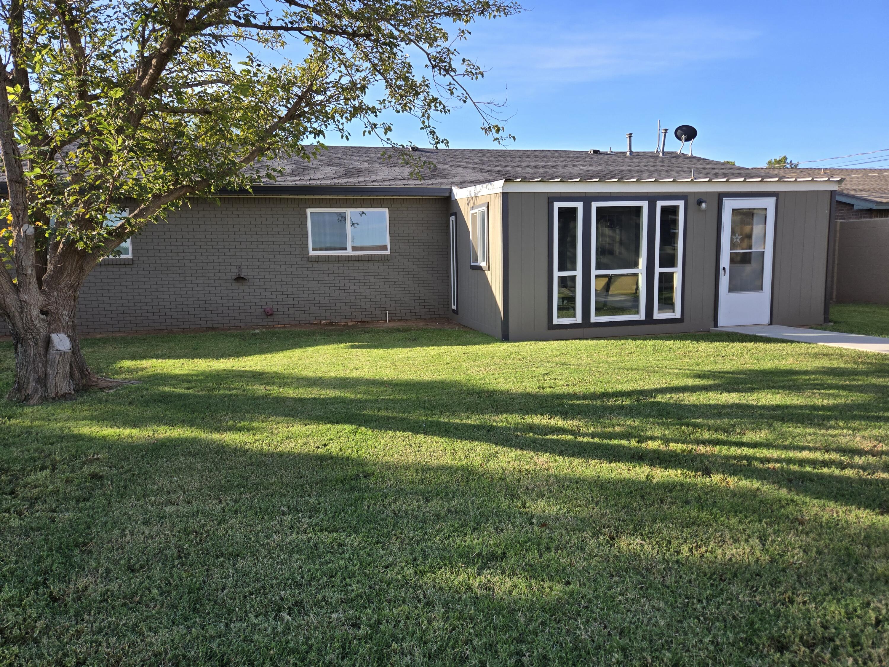 216 North 24th Street Lamesa, TX 79331 - Photo 25 of 27 a view of a house with a yard