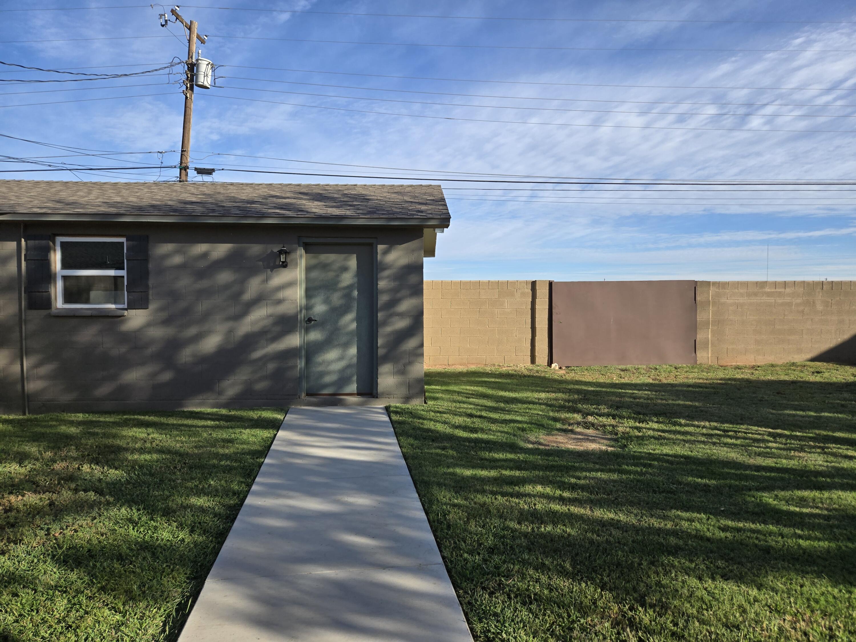 216 North 24th Street Lamesa, TX 79331 - Photo 27 of 27 a front view of a house with a garden