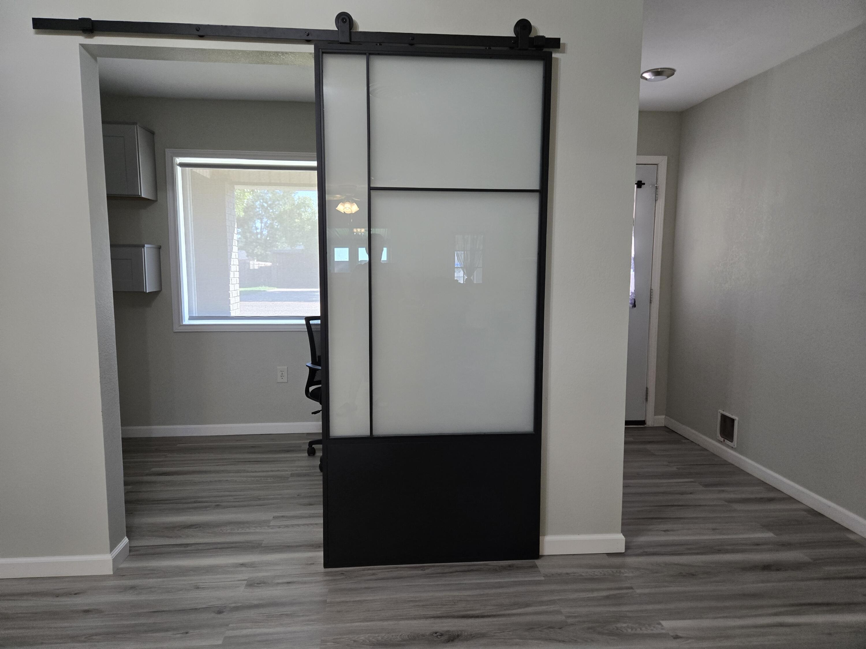 216 North 24th Street Lamesa, TX 79331 - Photo 5 of 27 a view of empty room with wooden floor