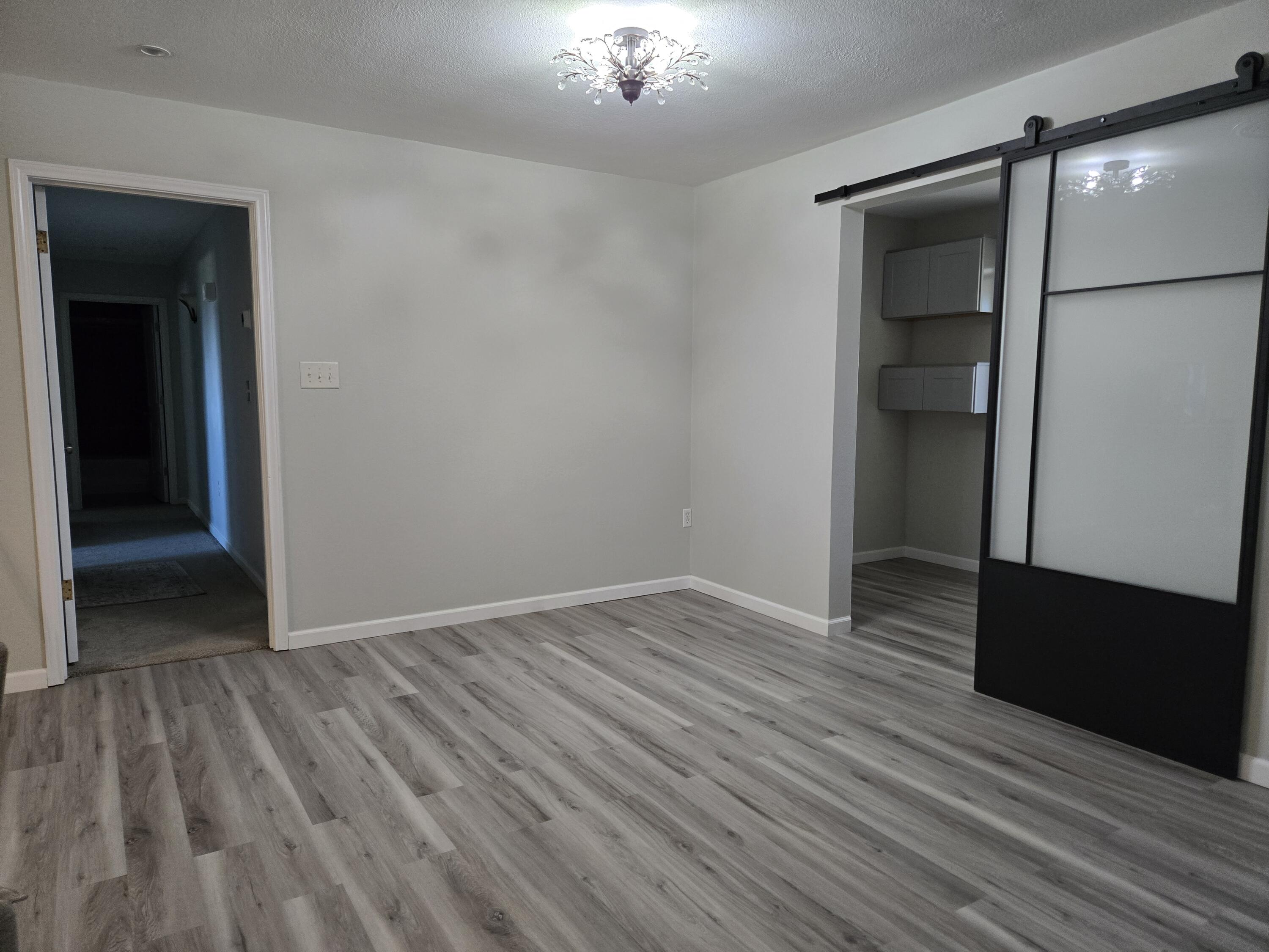216 North 24th Street Lamesa, TX 79331 - Photo 7 of 27 wooden floor in an empty room