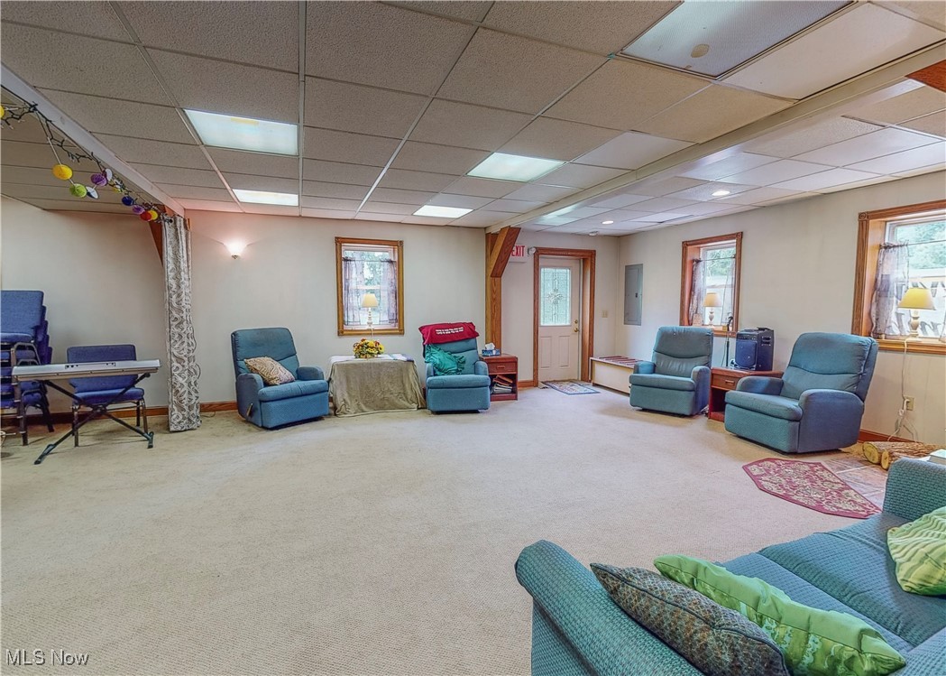 5696 Steubenville Road Southeast Amsterdam, OH 43903 - Photo 49 of 50 Carpeted living room featuring electric panel and a paneled ceiling