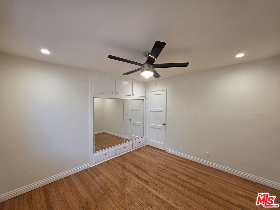 102 Gaviota Avenue, Unit 104 Long Beach, CA 90802 - Photo 13 of 42 a view of a big room with wooden floor and windows