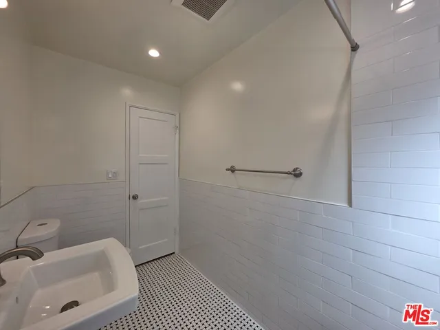 a bathroom with a sink and shower