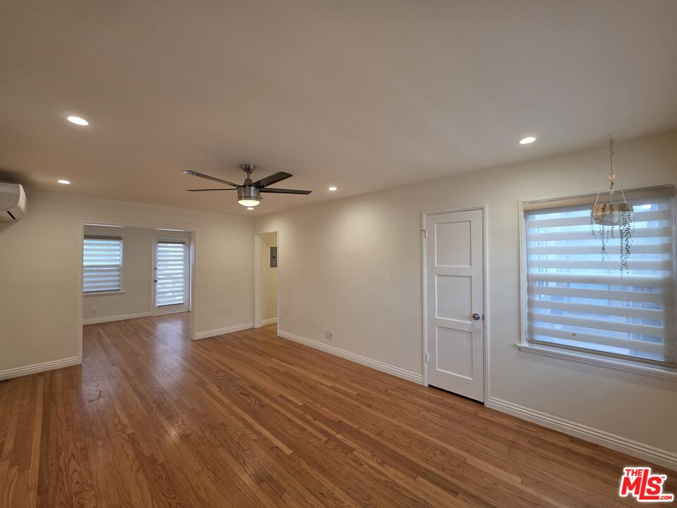 102 Gaviota Avenue, Unit 104 Long Beach, CA 90802 - Photo 28 of 42 wooden floor in an empty room with a window