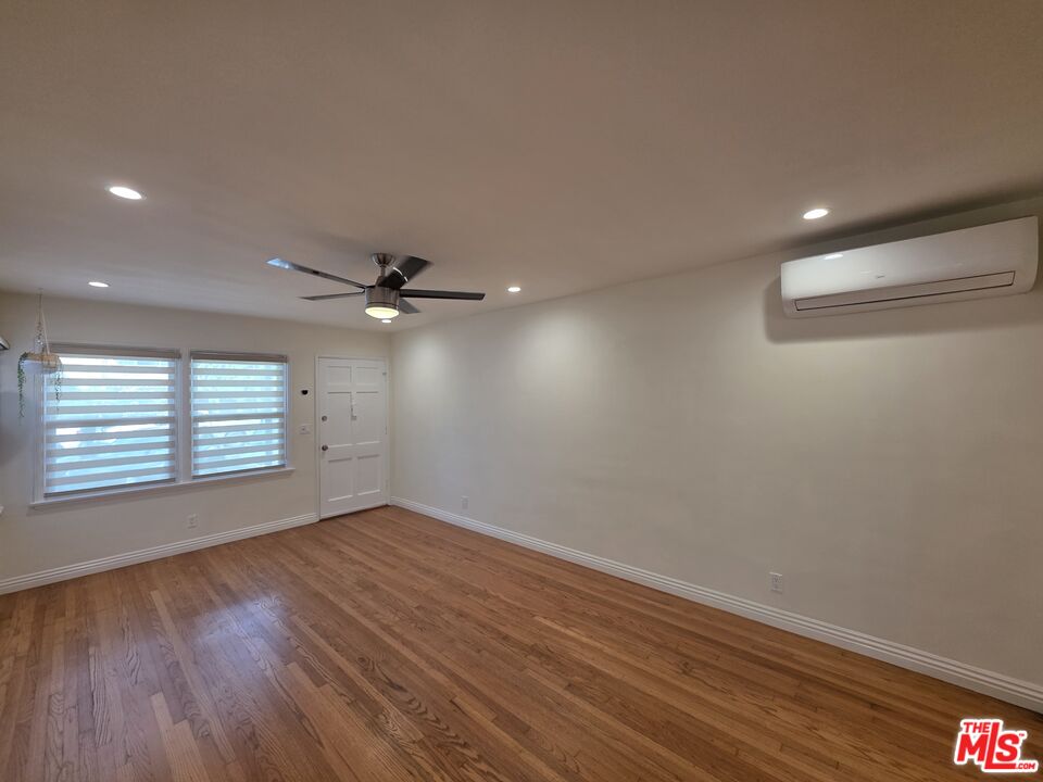 102 Gaviota Avenue, Unit 104 Long Beach, CA 90802 - Photo 32 of 42 wooden floor in an empty room with a window