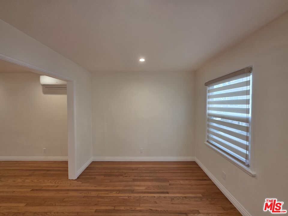 102 Gaviota Avenue, Unit 104 Long Beach, CA 90802 - Photo 41 of 42 a view of empty room with wooden floor and fan