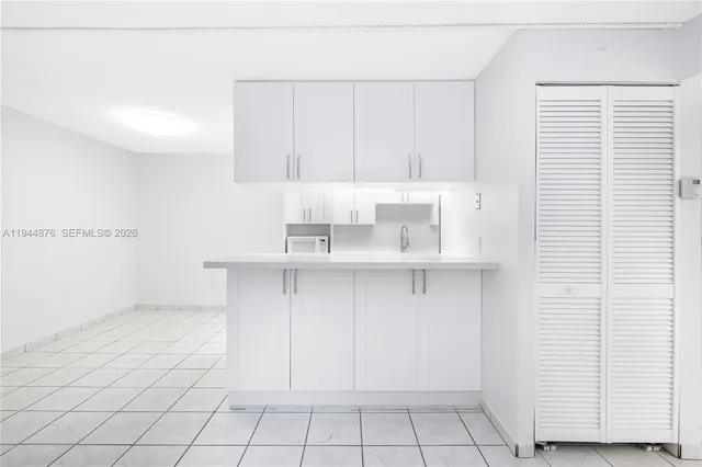 a kitchen with a white cabinets
