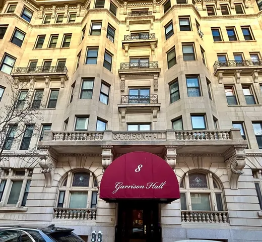 a front view of a building with retail shops