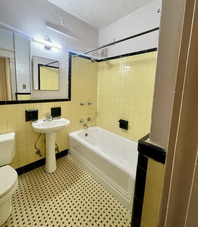 8 Garrison Street, Unit 608 Boston, MA 02116 - Photo 7 of 13 a bathroom with a sink toilet and shower